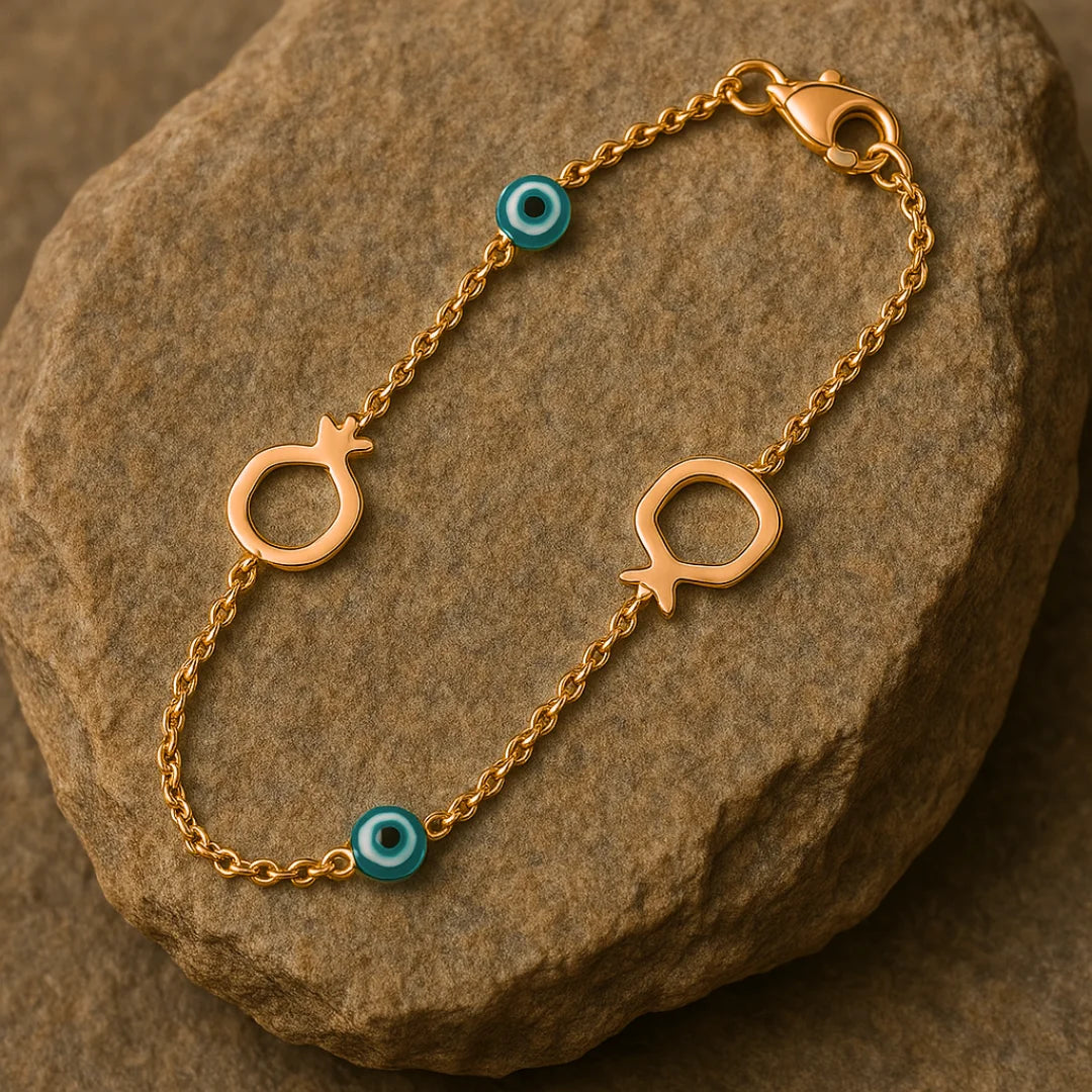 Bracelet éternel en or rose 14 carats avec breloques œil et grenade