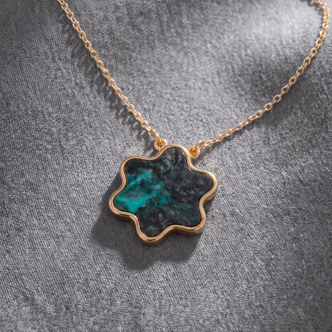 Tyferet Symbol Eilat Stone necklace on textured fabric