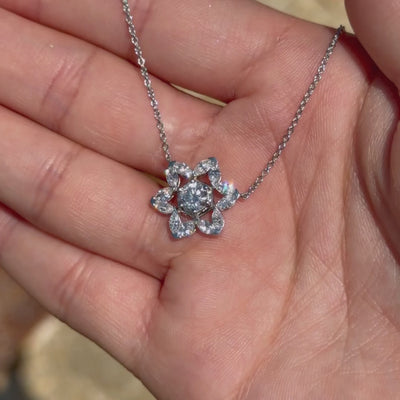 14K White gold Star of David Legacy Necklace with marquise diamonds shown in a hand outdoors