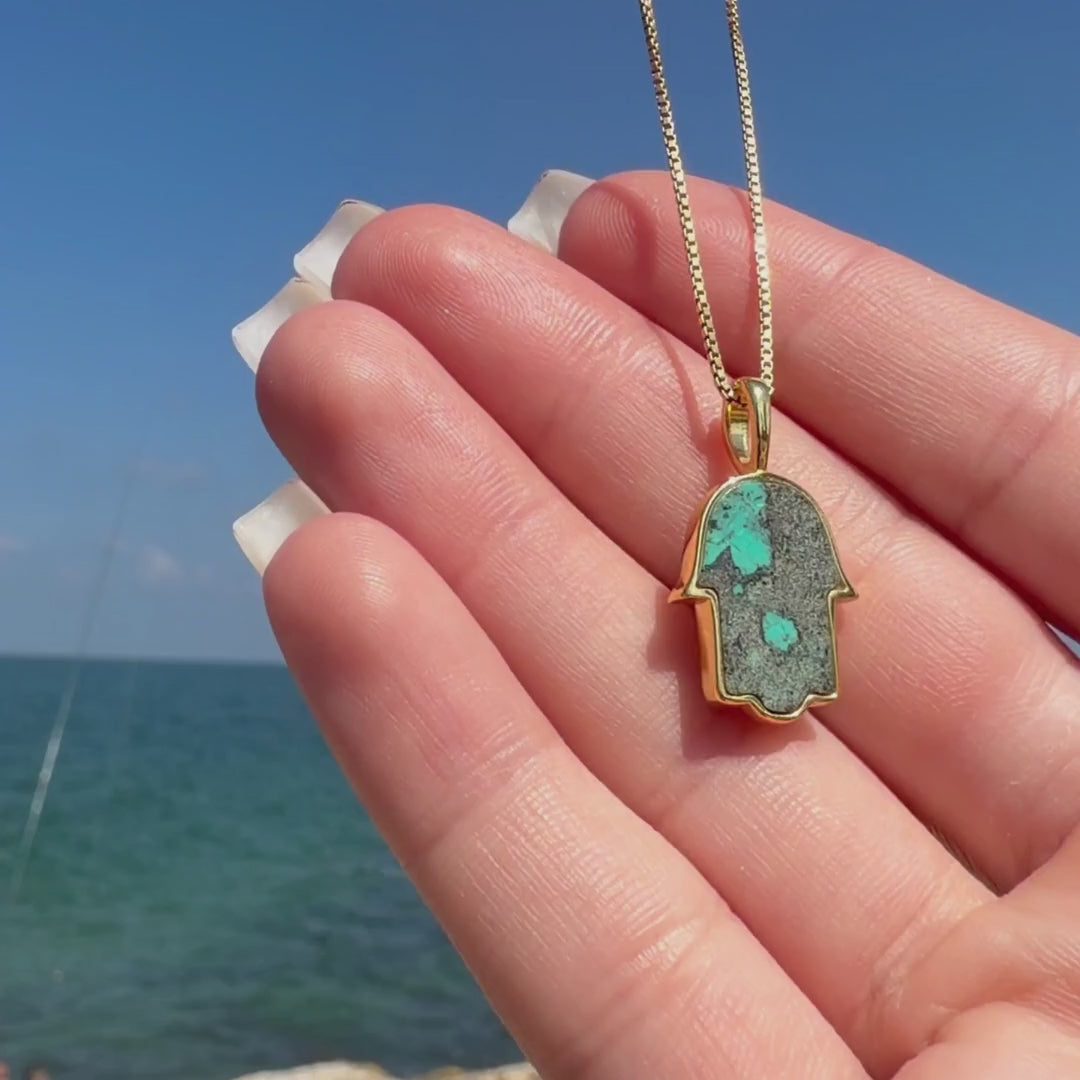 Eilat Stone and Diamonds Hamsa Necklace turned from its natural blue-green stone front to its diamond-pavé back